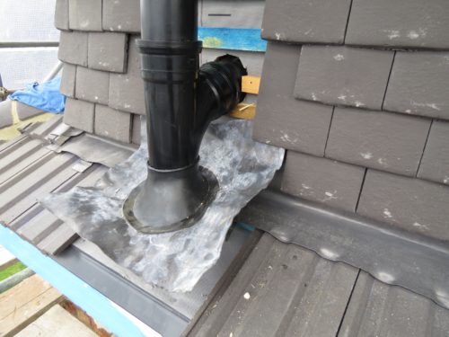 External view of soil pipe installed to side of roof