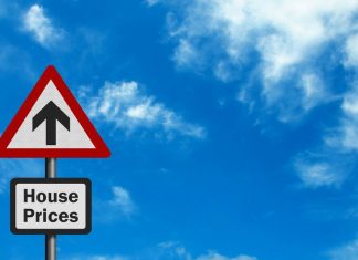 Image of a sign of house prices with an arrow pointing upwards
